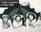  ??  ?? Under a parasol in Rhyl, 1951