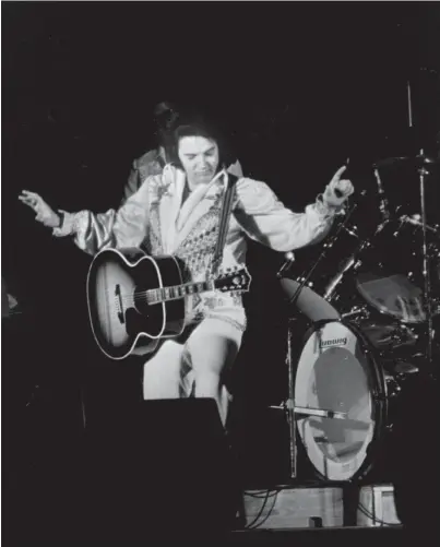  ?? THE COMMERCIAL APPEAL ?? Elvis Presley performs what would be his last Memphis concert on July 5, 1976, before a crowd of 12,000 at Mid-south Coliseum.