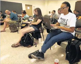  ?? Genaro Molina Los Angeles Times ?? SHELLV CANDLER, 28, attends a contempora­ry world history class at Cal State Long Beach. “There were times I thought about dropping out, but going to school was my escape,” she said.