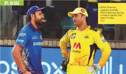  ?? BCCI ?? IPL IN UAE
Rohit Sharma
■ captain and MS Dhoni discuss during a match earlier this year in India.