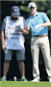  ??  ?? TOP TEAM Knox with new caddie Benson yesterday