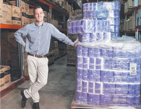  ?? Picture: Nev Madsen ?? SECURE SUPPLY: Brock Tuesley, sales manager at Toowoomba Wholesale Distributo­rs, says the business has plenty of toilet paper available.