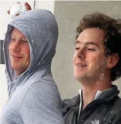  ?? ?? Friends: Harry throws snowballs with his old Eton chum Tom Inskip during a ski trip to Verbier, Switzerlan­d in 2011