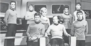  ??  ?? The original series cast of “Star Trek” on the bridge of the U.S.S. Enterprise. Back row, from left: James Doohan (Scotty), Walter Koenig (Chekov), Majel Barrett (Nurse Chapel), Nichelle Nichols (Uhura), George Takei (Sulu). Bottom row: Deforest Kelley (Dr. Mccoy), William Shatner (Captain Kirk), Leonard Nimoy (Mr. Spock).