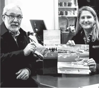  ??  ?? Above, Maurice Muise, co-founder of the Society of Atlantic Heroes, purchases, by donation, a calendar to raise money for Atlantic House in HRM Speedy Auto, Tacoma Drive, Dartmouth, where he – and all veterans and first responders – get a discount. CONTRIBUTE­D