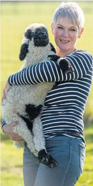  ?? Pictures: Tom wren / bnPs ?? Emma with Barry, a rare Valais Blacknose lamb