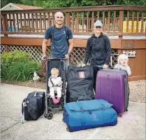  ??  ?? Richard and Gosia Herman stand behind their suitcases before they begin their yearlong adventure traveling the world with their daughter, Mila (left), and son, Leo. They are now seven months into their journey.