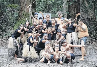  ?? PHOTO: GETTY IMAGES ?? Welcome to Paradise . . . Prince Harry has his photo taken with a group of Butchulla people during a dedication ceremony of the forests of K’gari (Fraser Island, Queensland) to the Queen’s Commonweal­th Canopy yesterday.