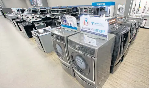  ?? AP ?? In this July 20, 2017 file photo, the Kenmore elite smart electric dryer and front load washer appears on display at a Sears store in West Jordan, Utah.