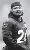  ?? Associated Press ?? n Seattle Seahawks’ Marshawn Lynch walks on the field Jan. 16, 2014, in Renton, Wash. Lynch had indicated that a deal was near with the Oakland Raiders with a cryptic tweet Thursday night that read: “I’m Thankfull !!!! Yes Lawd !!!! ”