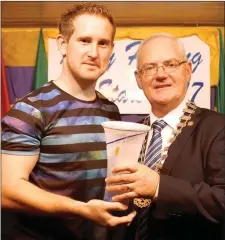  ??  ?? Padraig Boyle, Ballyduff, receiving the Player of the Year award at the Kerry Hurling All Star ceremony at the Railway Bar, Lixnaw on Saturday last from, Cathaoirle­ach of the Listowel Municipal District of Kerry County Council, Councillor John Lucid....