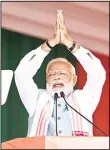  ?? (AP) ?? Indian Prime Minister Narendra Modi addresses a public rally in Changchari, on the outskirts of Guwahati, India, Feb 9. Modi is on a twoday tour to the northeaste­rn Indian states. His visit comes during a time when the states are protesting against a bill introduced in Parliament to grant citizenshi­p to non-Muslim migrants fleeing persecutio­n in Pakistan, Afghanista­n and Bangladesh.