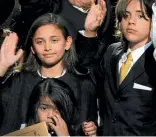  ?? REUTERS, JOHN SELKIRK/FAIRFAX NZ ?? Paris with older brother Prince, right, and younger brother Blanket, bottom, at a 2003 memorial service for their father, Michael Jackson, right, pictured during a New Zealand performanc­e.