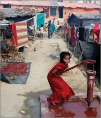  ?? PICTURE: REUTERS ?? A Rohingya refugee girl plays at a tube-well in Palong Khali camp near Cox’s Bazar in Bangladesh this week.