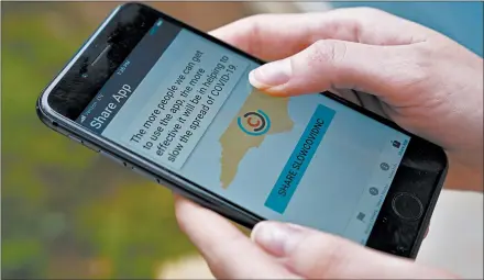 ?? CHRIS CARLSON/AP ?? North Carolina is among 18 states and territorie­s to have made available apps notifying people who may have been exposed to the coronaviru­s.