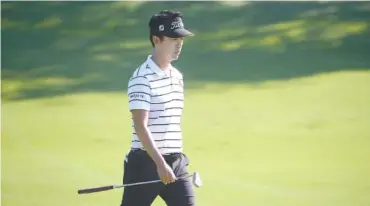  ?? ASSOCIATED PRESS FILE PHOTO ?? Kevin Na walks down the eighth fairway March 18 during the Arnold Palmer Invitation­al in Orlando, Florida. Na ended the first day of the Fort Worth Invitation­al with an 8-under-par 62, giving him a one-stroke lead over Charley Hoffman.