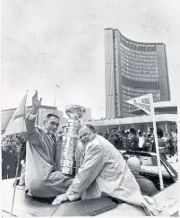  ?? DICK DARRELL FILE PHOTO ?? Armstrong, left, and former Maple Leafs owner Harold Ballard with the Stanley Cup at Nathan Phillips Square in 1967.