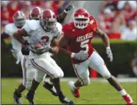  ?? (Arkansas Democrat-Gazette file photo) ?? Arkansas tailback Darren McFadden (right) runs down Alabama cornerback Simeon Castille after Castille picked off Arkansas quarterbac­k Mitch Mustain.