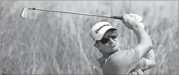  ?? Dave Thompson / The Associated Press ?? Justin Rose plays a shot on the 10th hole Tuesday during a practice round ahead of the British Open Golf Championsh­ip.