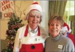  ?? TRACEY READ — THE NEWS-HERALD ?? Lake County Historical Society volunteer Sandy Nelson, left, and Board of Directors member Marian Redmond pose Dec. 2 in Painesvill­e Twp.