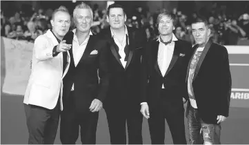  ??  ?? Spandau Ballet band members Gary Kemp, Martin Kemp,Tony Hadley, Steve Norman and John Keeble (Left-Right) pose on the red carpet for the documentar­y “Soul Boys Of The Western World” at the Rome Film Festival Oct 20, 2014. — Reuters file photo