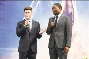  ??  ?? Colin Jost, left, and Michael Che, co-hosts for the 70th Emmy Awards, speak to the media before rolling out the gold carpet outside the Microsoft Theatre in Los Angeles on Thursday. The 70th Emmy Awards will air at 8 p.m. Monday on NBC.