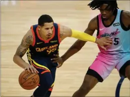  ?? NHAT V. MEYER — BAY AREA NEWS GROUP ?? The Warriors’ Juan Toscano-Anderson (95) dribbles against a Miami Heat defender in the third quarter at the Chase Center in San Francisco on Feb. 17.