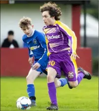  ??  ?? Wexford’s Ben Rossiter racing away from Jack Daly.