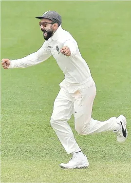  ?? Picture: AFP ?? EUPHORIC. Indian captain Virat Kohli celebrates after beating Australia on the final day of the first Test in Adelaide yesterday.