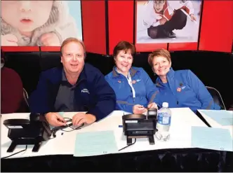  ?? Special to The Herald ?? Minuteman Press Printing co-owner Andre Martin, left, is pictured with volunteers from the 2018 Scotties Tournament of Hearts curling championsh­ips. Minuteman was one of the many local businesses that got behind this month’s national championsh­ip.