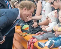  ?? Photo: FAIRFAX NZ ?? Prince Harry and baby Pippa, aged 7 months, get to know each other in Christchur­ch.