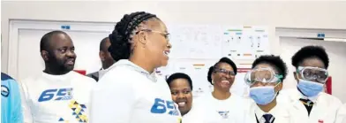  ?? ?? MEC Mbali Frazer (front) joined by EHS principal Sizwe Zwane (left), King Cetshwayo District acting director of education Welile Nzama and pupils at the official unveiling of the science laboratory