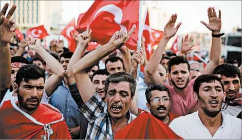  ?? YASIN AKGUL/GETTY-AFP ?? Pro-government supporters pack Taksim Square on Saturday in Istanbul after a failed military coup the night before.