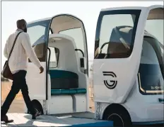  ?? COURTESY GLYDWAYS ?? A passenger enters Glydways, a driverless vehicle.