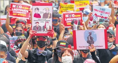  ?? REUTERS ?? Protesters display banners denouncing the military coup in Myanmar, at a march in Taipei, Taiwan,