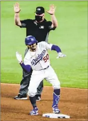  ??  ?? MOOKIE BETTS is happy after doubling during the sixth inning for the Dodgers’ f irst hit of the game.