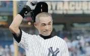  ?? KATHY WILLENS/THE ASSOCIATED PRESS ?? Ichiro Suzuki salutes the crowd after connecting for his 4,000th career hit.