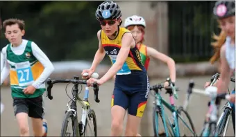  ??  ?? Eddie Allen from Laois collects his bike for the cycling phase of the Duathlon