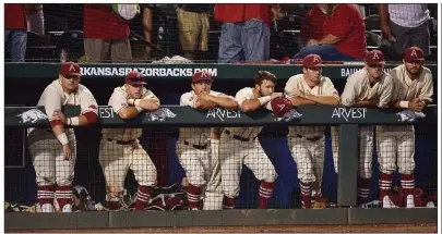  ?? NWA Democrat-Gazette/BEN GOFF ?? Arkansas players watch from the dugout as Missouri State players celebrate on the field after the Bears’ 3-2 victory over the Razorbacks in the final game of the NCAA Fayettevil­le Regional in June. “It doesn’t sit well with us, especially watching them...