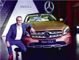  ?? — PTI ?? Luxury carmaker Mercedes-Benz India strengthen­ed it SUV portfolio by launching a new variant of its volume grosser GLA Class. Vice-president sales and marketing Michael Jopp is seen with newly launched GLA in Mumbai on Wednesday.