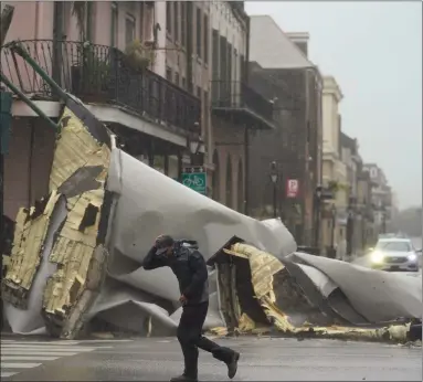  ?? Picture: Ap/eric Gay ?? Streets in the French Quarter of New Orleans were made dangerous by Hurricane Ida’s high winds, which blew off sections of buildings