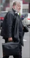  ??  ?? Chad Davidson’s lawyer, Stephen White, leaves the courthouse Friday.