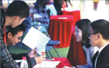  ?? PHOTOS BY CHU LIN / FOR CHINA DAILY ?? Fresh graduates attend a two-way selection job fair at Central China Normal University in Wuhan, Hubei province. is offered by the Optics Valley to fund young entreprene­urs and inventors worldwide