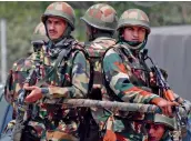  ?? — PTI ?? Security personnel stand guard near Delhi Public School during an encounter with the militants at Pantha Chowk in Srinagar on Sunday.