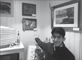  ?? COURTESY OF SHIRIN BORHANI ?? Omid Izadi showcases his award winning art at his home in Lockeford.