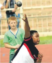  ??  ?? Johannes Tjelele from Latlile Primary School attains a distance of 5,56 m with this throw in the boys u.13 shot put.