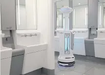  ??  ?? An Intelligen­t Sterilizat­ion Robot, produced by TMiRob of China, uses UV light to sanitise a washroom at Hong Kong Airport.