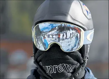  ?? Photos by Andy Cross / The Denver Post ?? Dylan Barr waits in the Black Mountain Express lift to ride Arapahoe Basin for its reopening May 27.