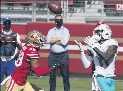  ?? PHOTOS BY TONY AVELAR — THE ASSOCIATED PRESS ?? Miami Dolphins wide receiver DeVante Parker (11) catches a touchdown against San Francisco 49ers cornerback Brian Allen (48) during the first half Sunday in Santa Clara.