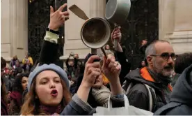  ?? Photograph: Thibault Camus/AP ?? People bang pots and pans while French President Emmanuel Macron seeks to diffuse tensions in a televised address to the nation on 17 April 2023 in Paris.